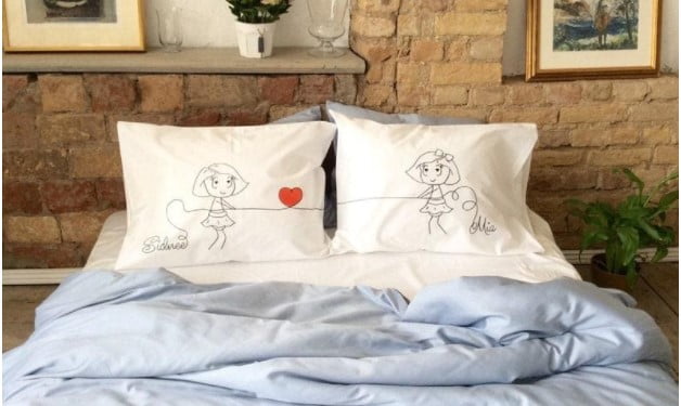 White pillowcases with black and white women’s names as a lesbian Valentine’s Day gift idea
